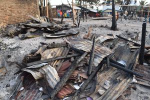 burnt tin roofing in the aftermath of the fire