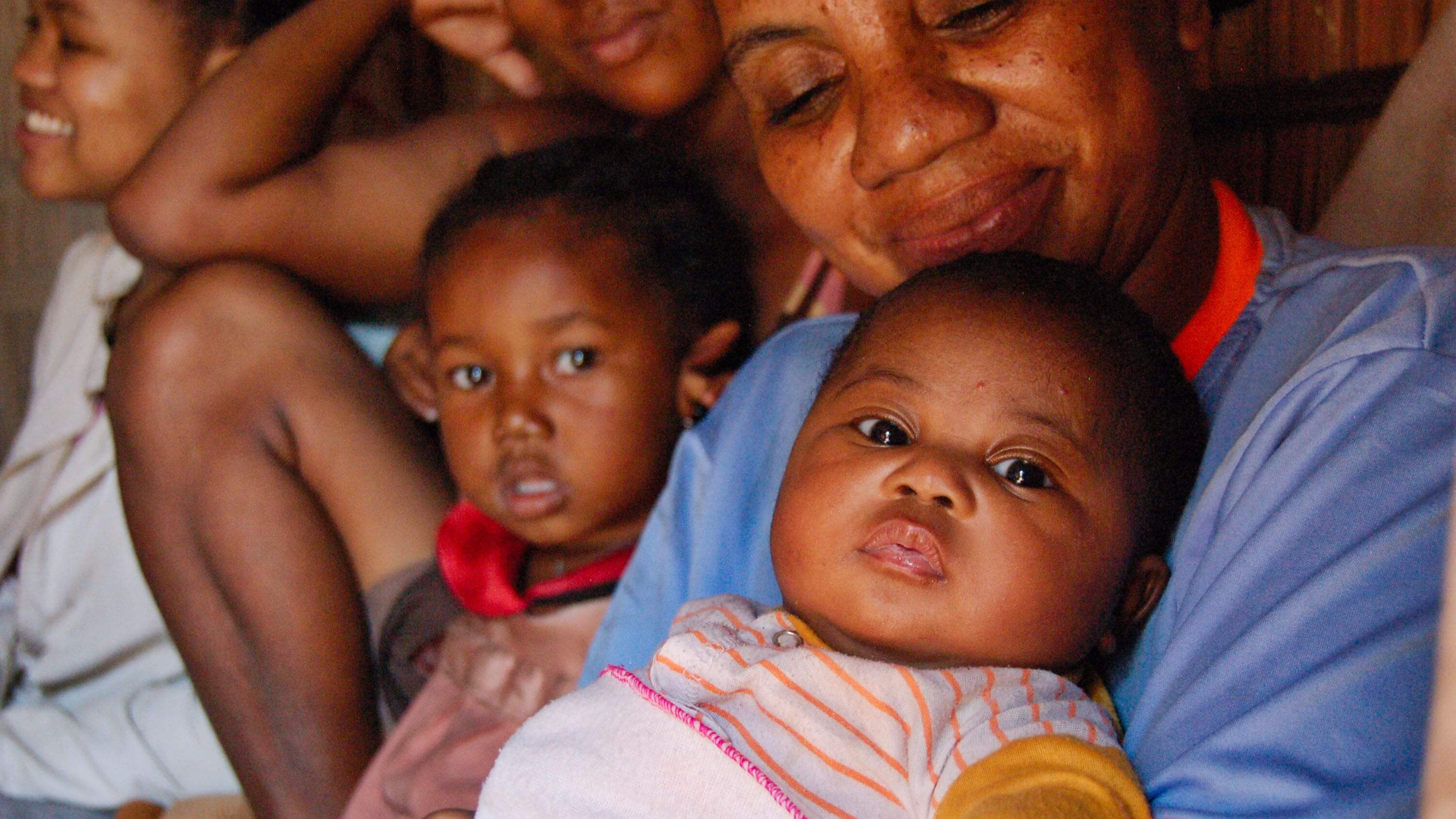 Votsira Government Agent (GA) with a baby during household visits in Anbinanibe, Fort Dauphin