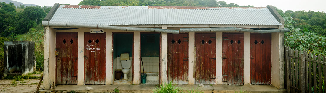 Damaged and dirty previous latrines at the hospital