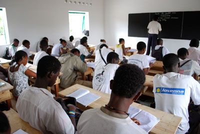 Malagasy students sitting in a finished classroom in a SEED school