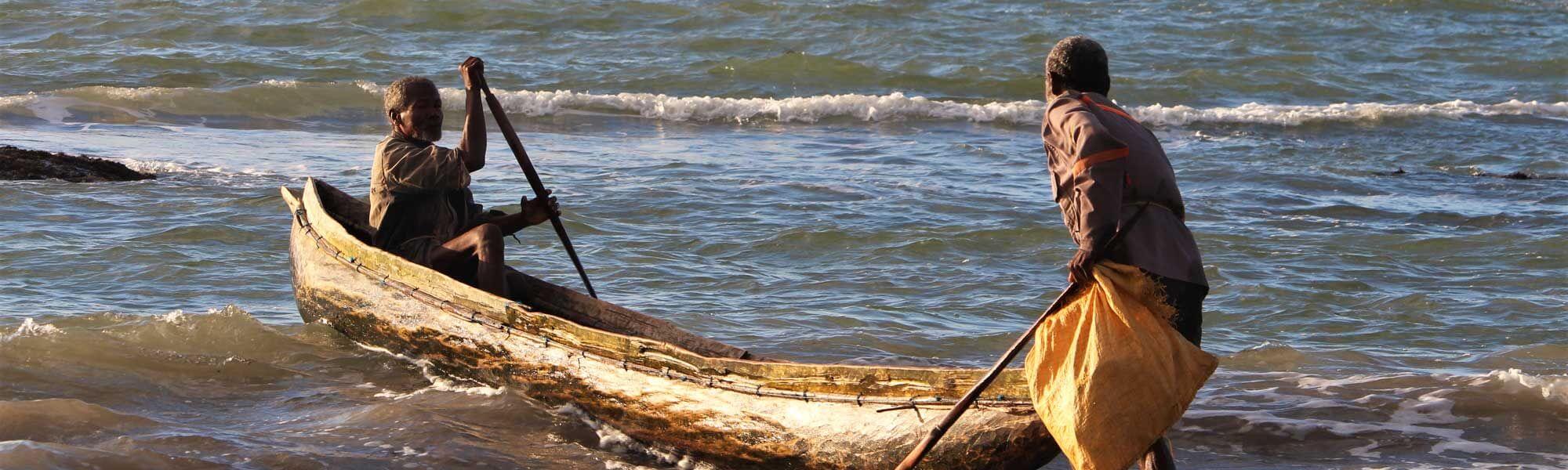 Fishers using a pirogue canoe at a lobster fishery in southeast Madagascar