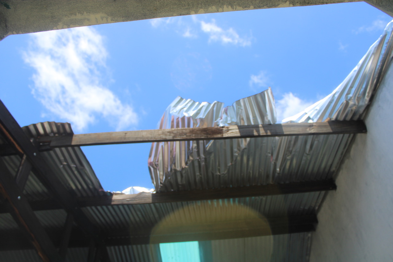 A damaged metal roof