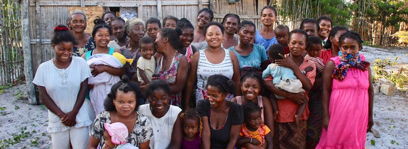 A group of women from The Mahampy Weavers Cooperative smiling