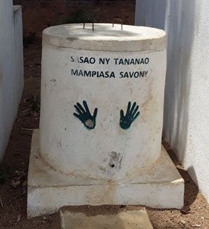  A handwashing station with educational sign handprints