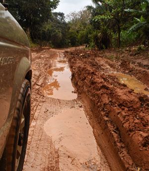 A bad road with water and potholes in rural Madagascar