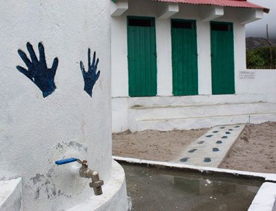 WASH nudges - handprints - on a tap at a SEED school