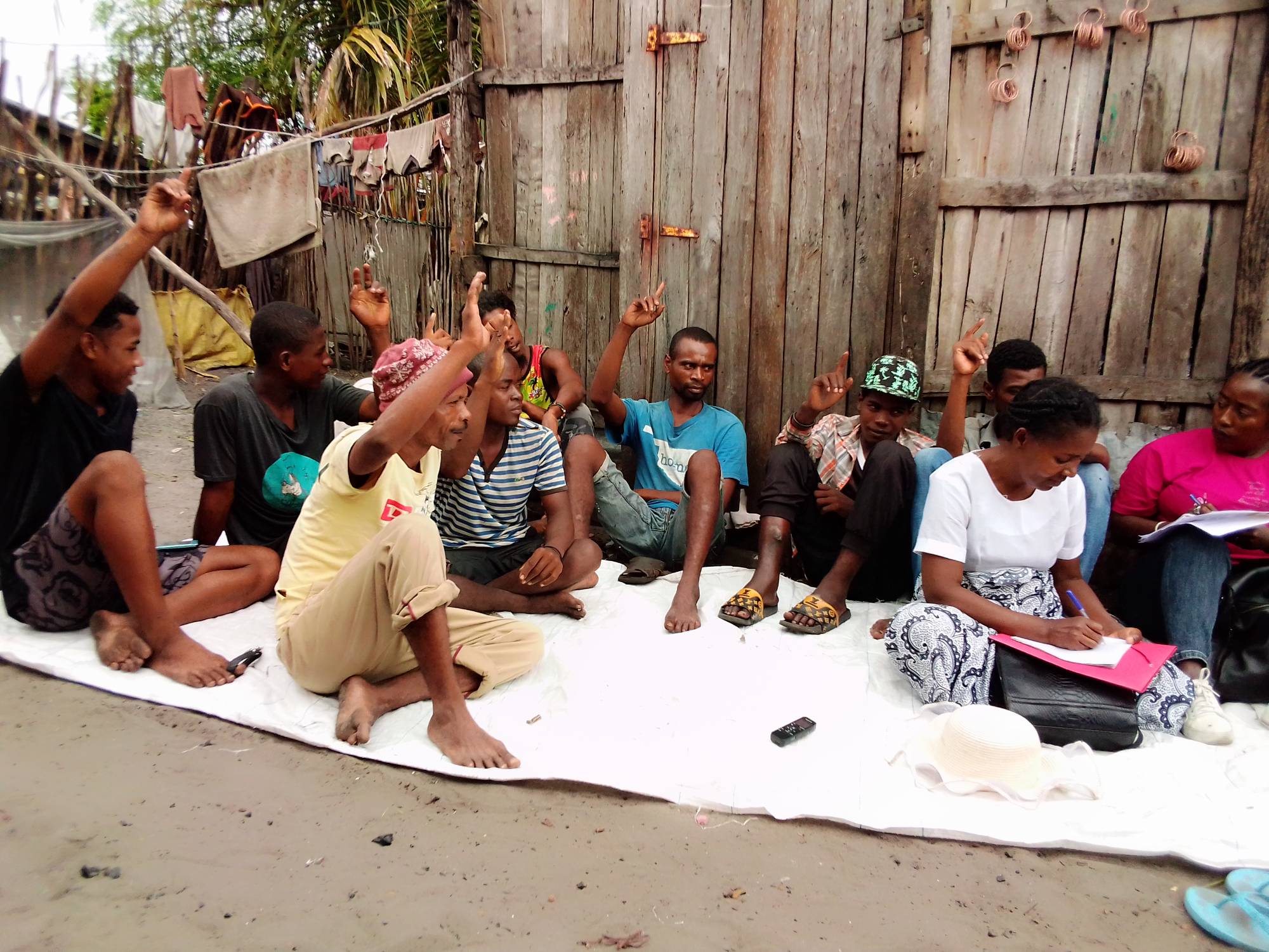 Fathers sit at a Project Votsira community information session