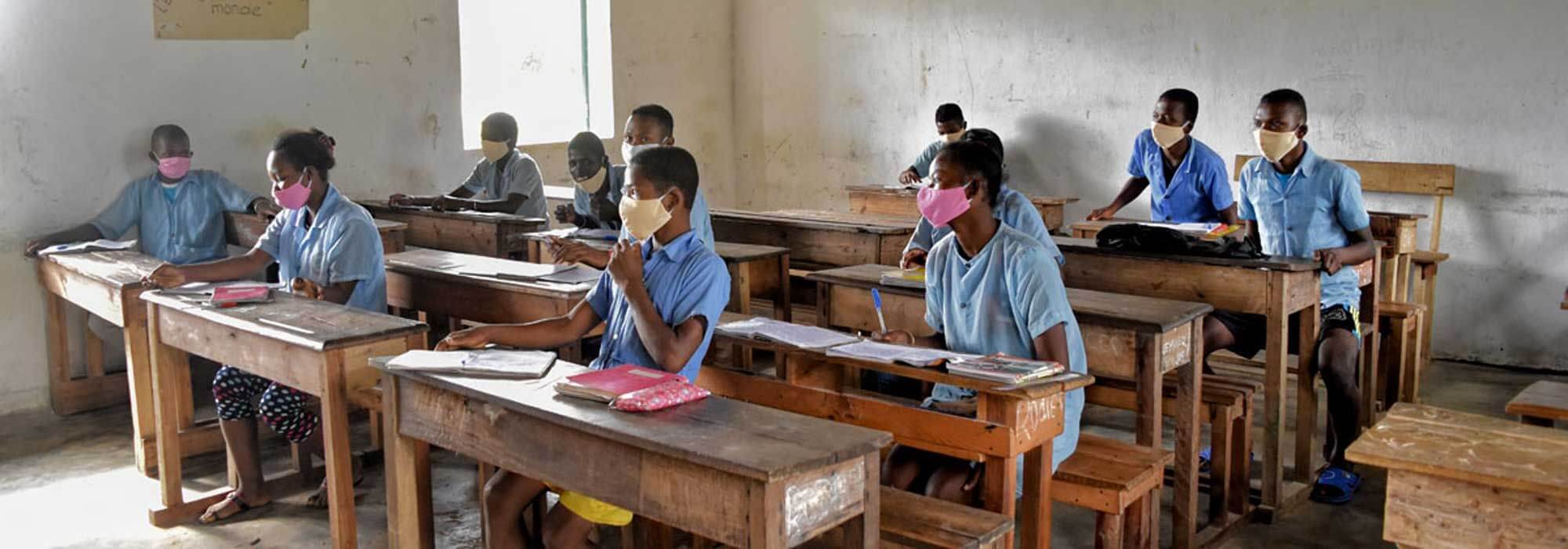 Socially distanced students in a school wear face masks Madagascar