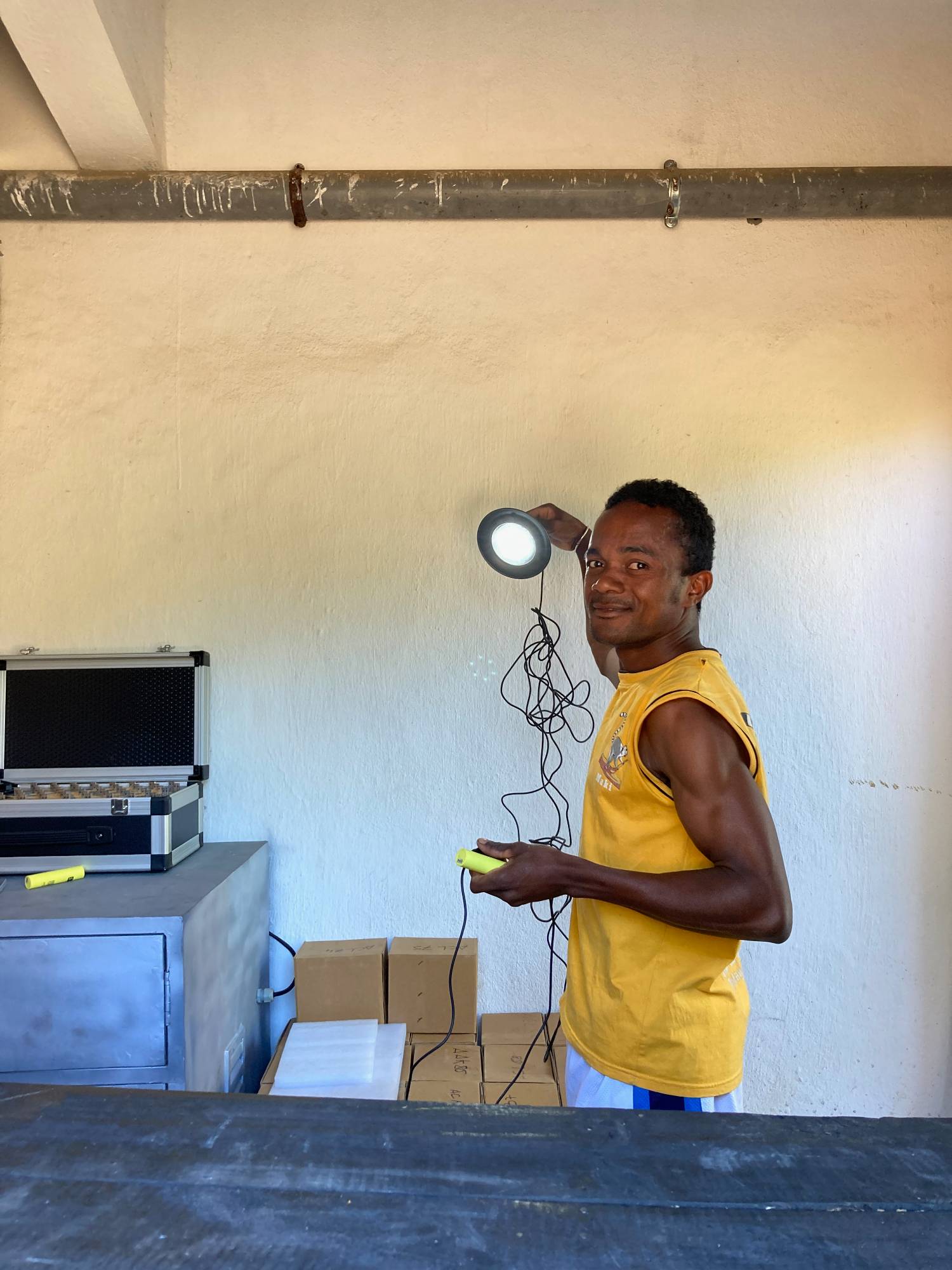 A portable battery powers a lamp in Madagascar