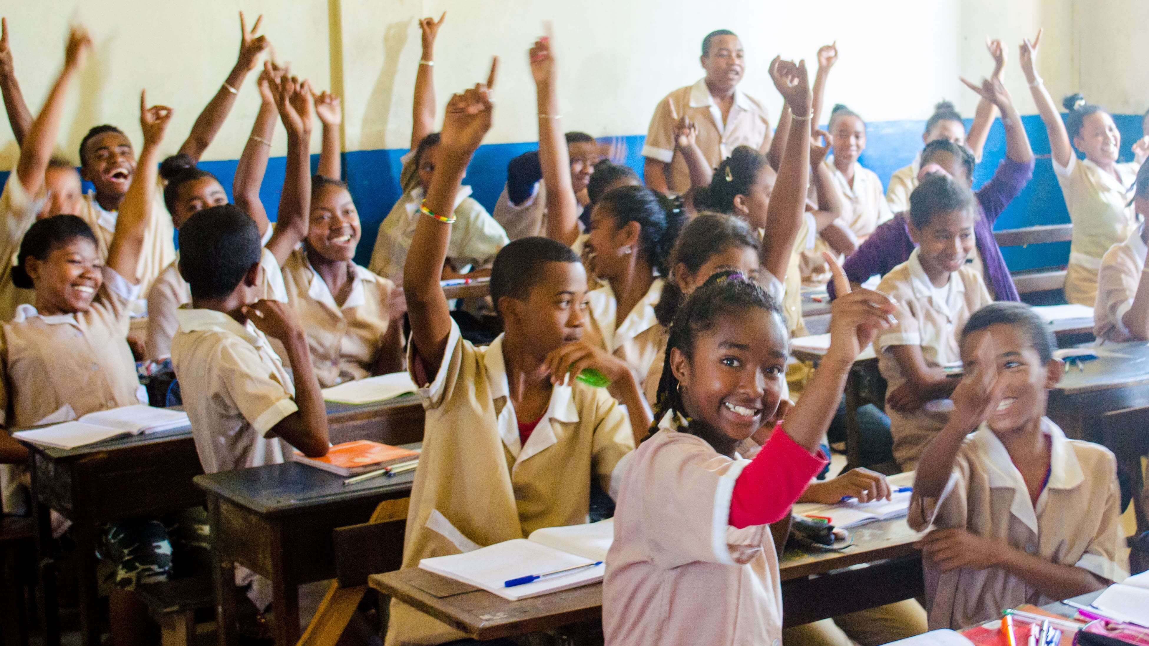 Excited children during a lesson in a classroom built by SEED Madagascar