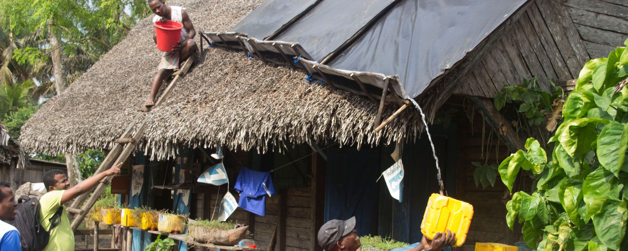 A rooftop rainwater harvesting system being installed for a household in Mahatalaky, Madagascar