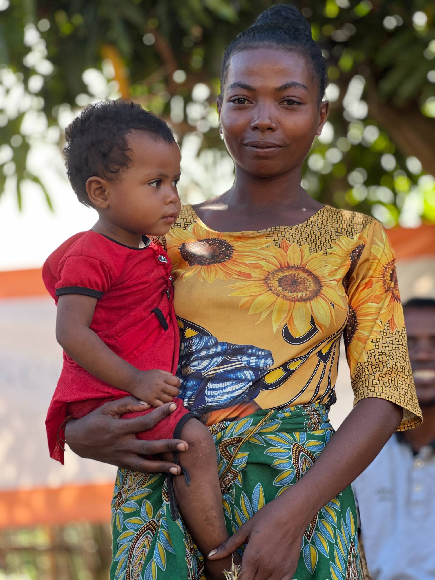 A Malagasy mother holding her child