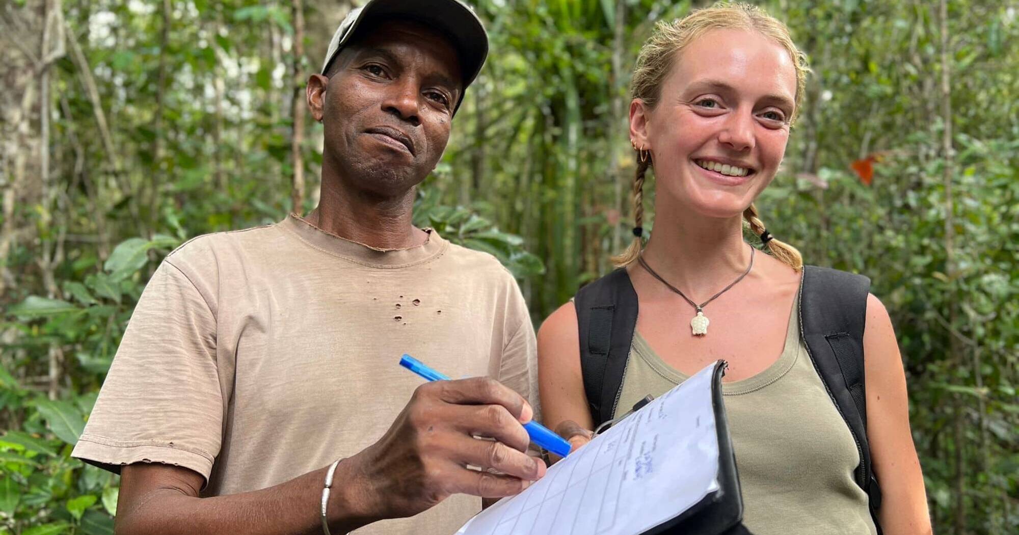 Bella and local guide Solo smiling in the forests of Sainte Luce, Madagascar